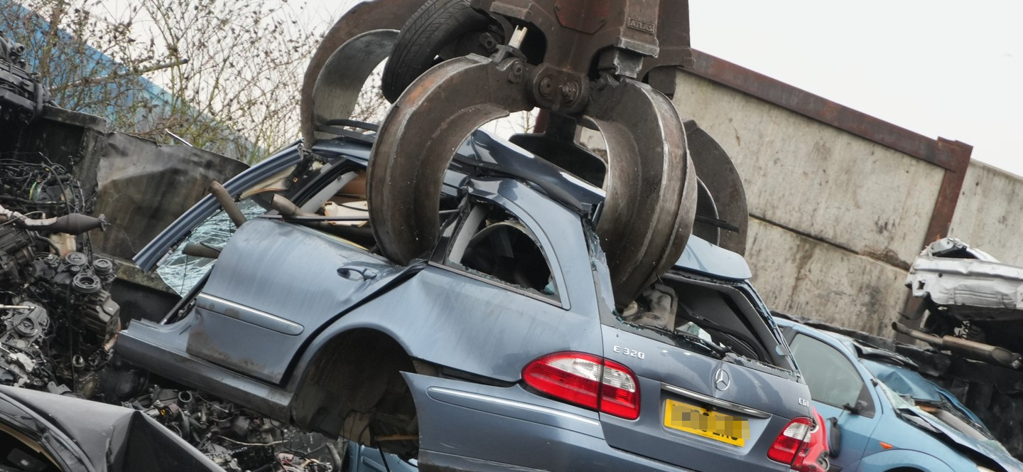 scrap car in claw at Benfleet Scrap