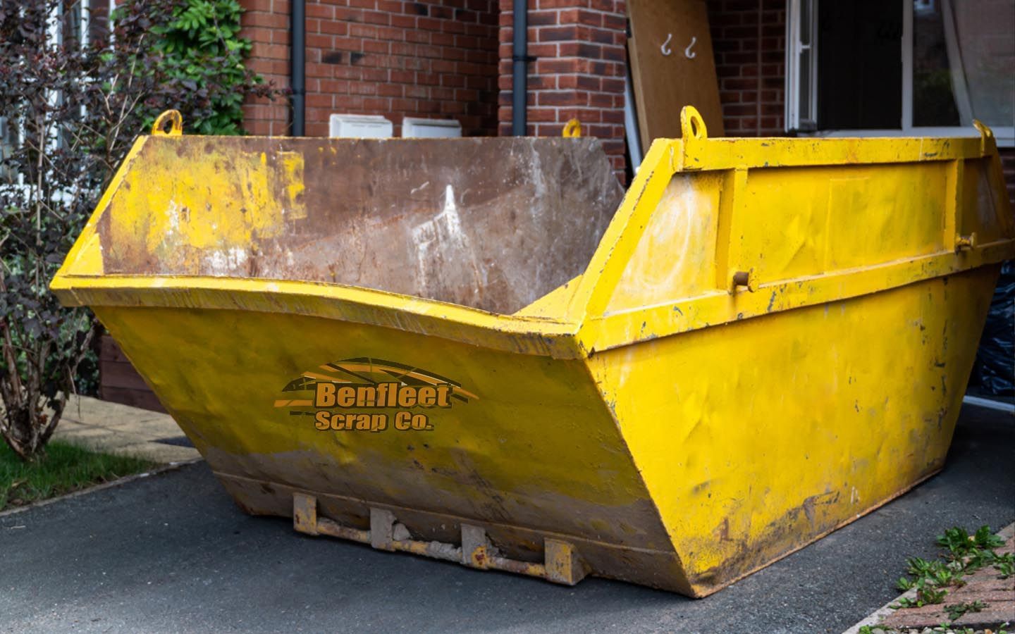 Yellow skip with Benfleet Scrap logo