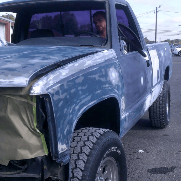 A blue damaged truck.