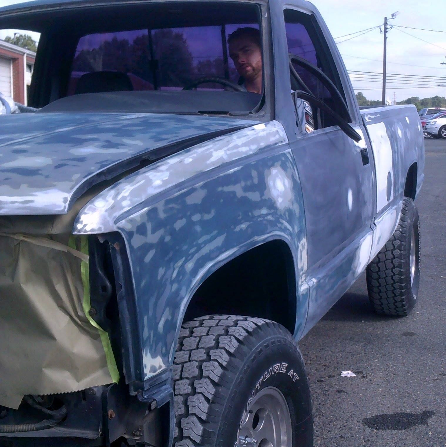 A blue damaged truck.