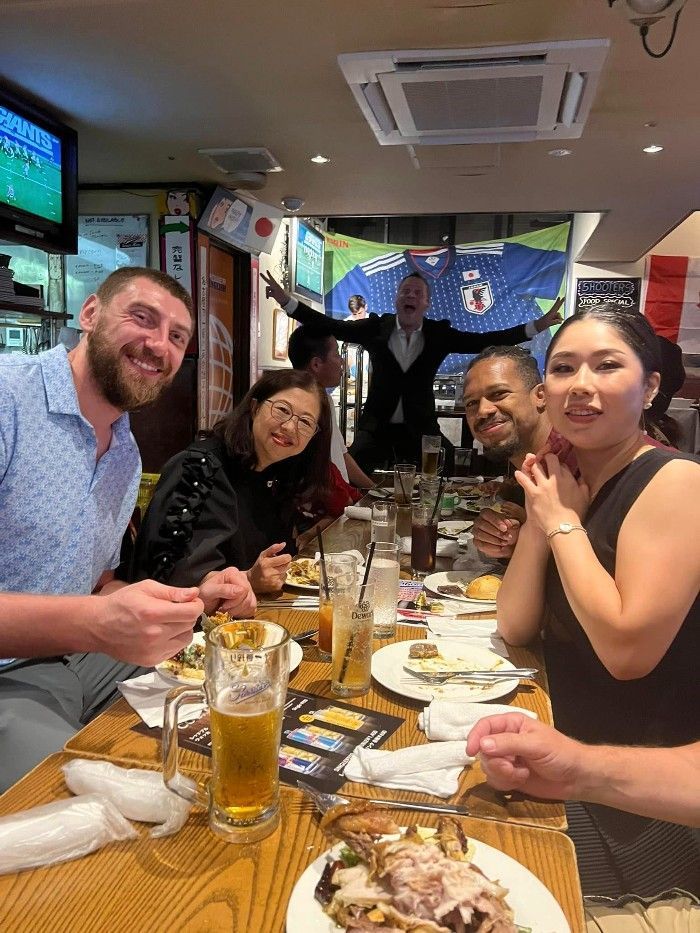 Friends enjoying Thanksgiving dinner at Shooters in Nagoya
