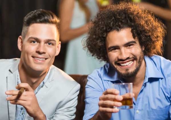 2 guys enjoying cigars