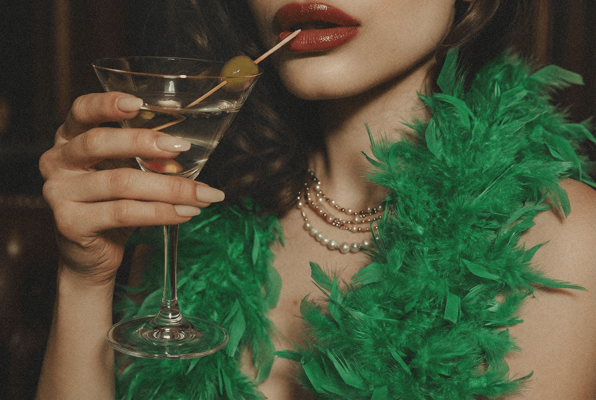 Green feather boa and cocktail