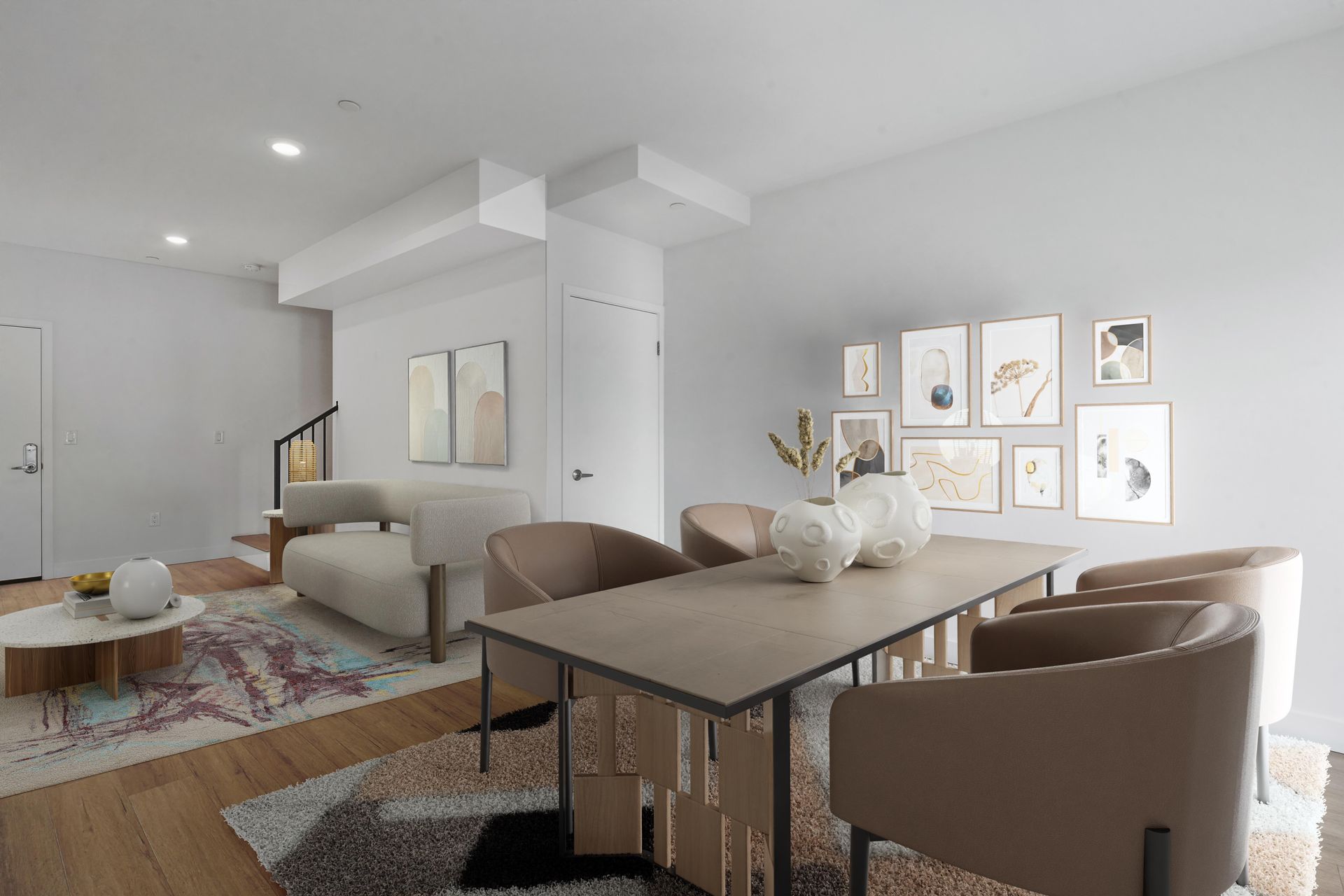 A living room with a dining table and chairs and a couch.