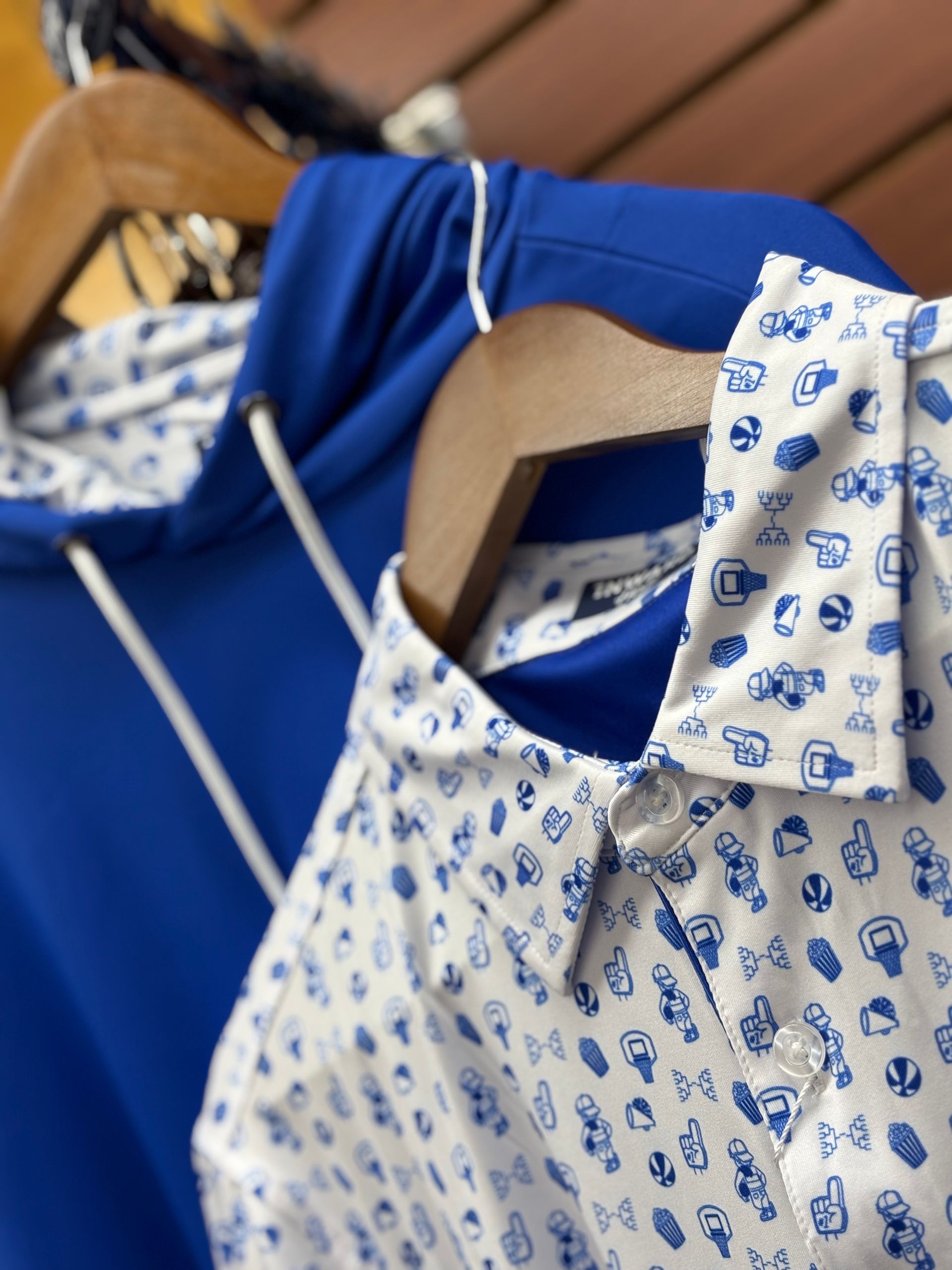 A display of golf shoes in boxes on a shelf in a store.