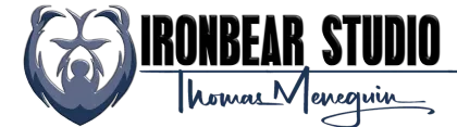 Logo: Ironbear Studio with a bear emblem and signature of Thomas Menequin.