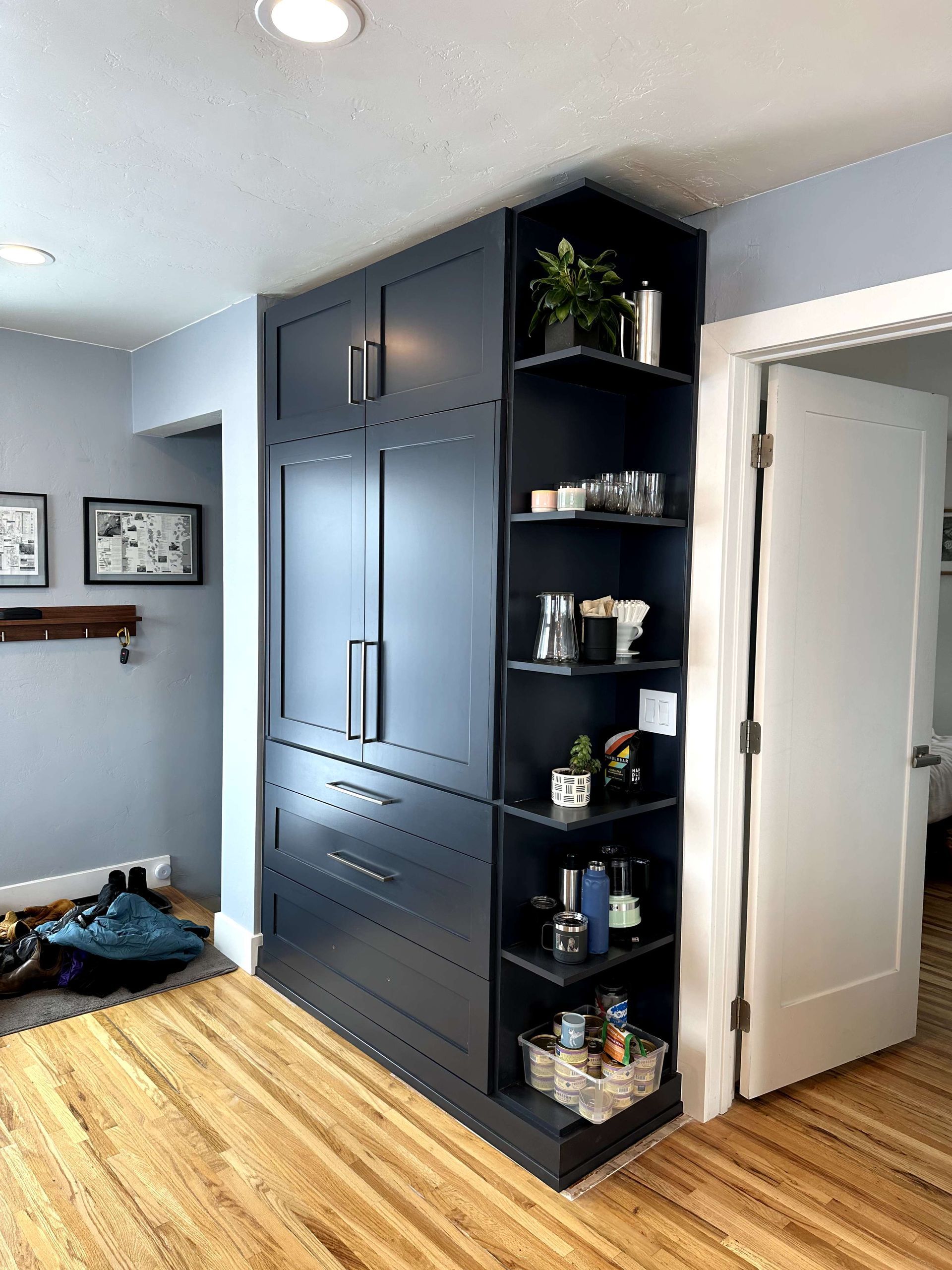 A room with a lot of shelves and cabinets in it