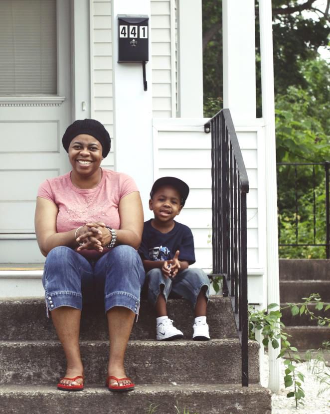 Jennifer Mathis and her young son outside their new home.