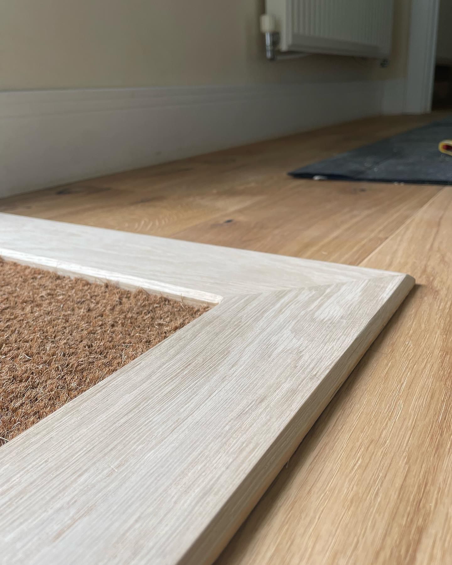 a piece of wood is sitting on top of a wooden floor .