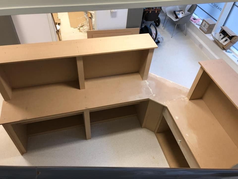 an aerial view of a cardboard desk in a room .