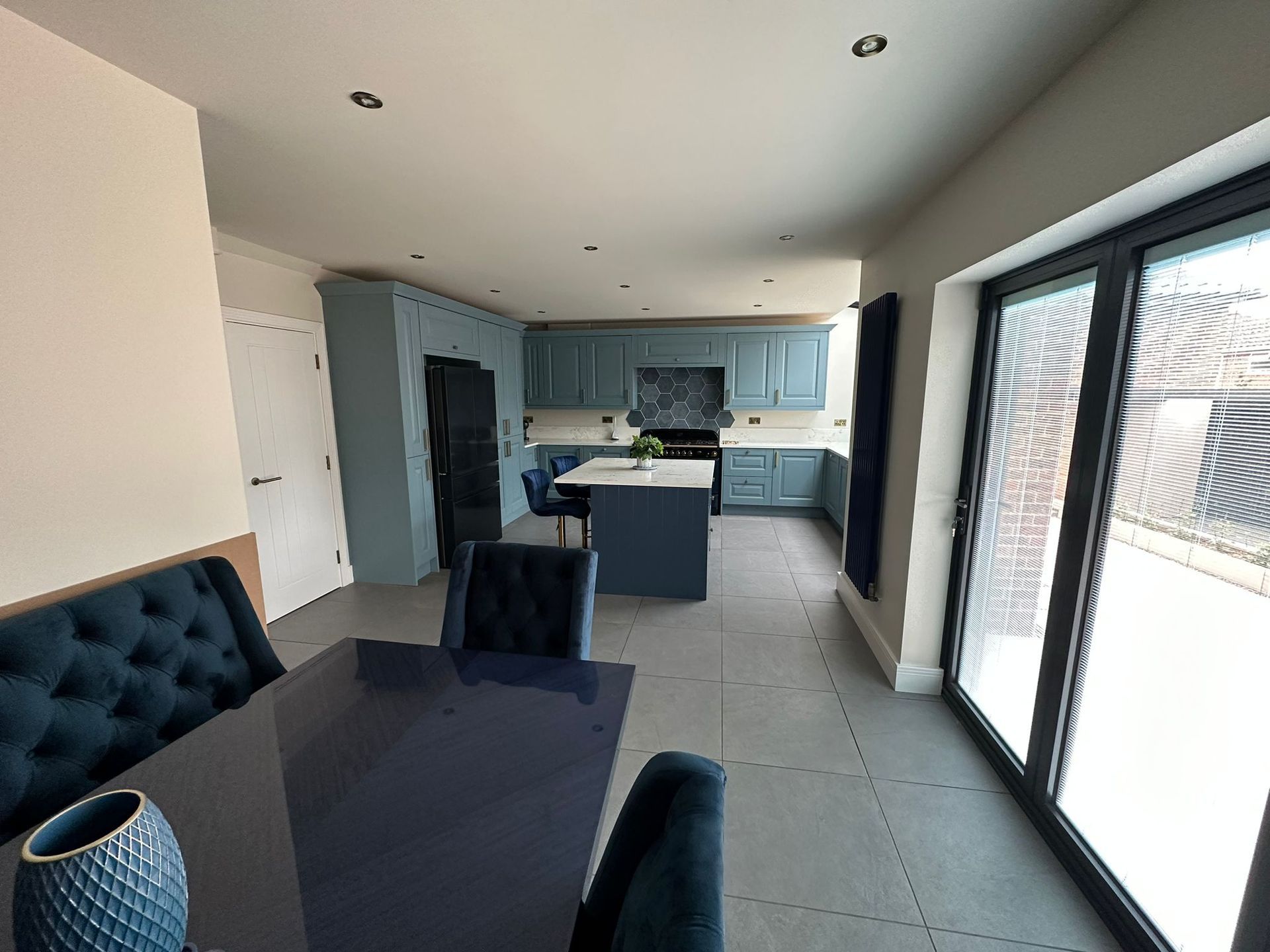 a kitchen with a table and chairs in it