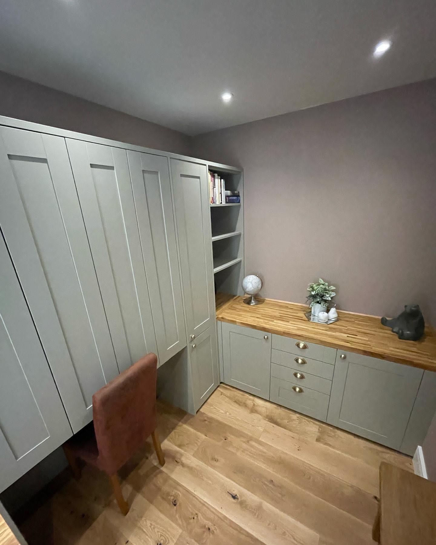 a room with a desk and a chair in it .