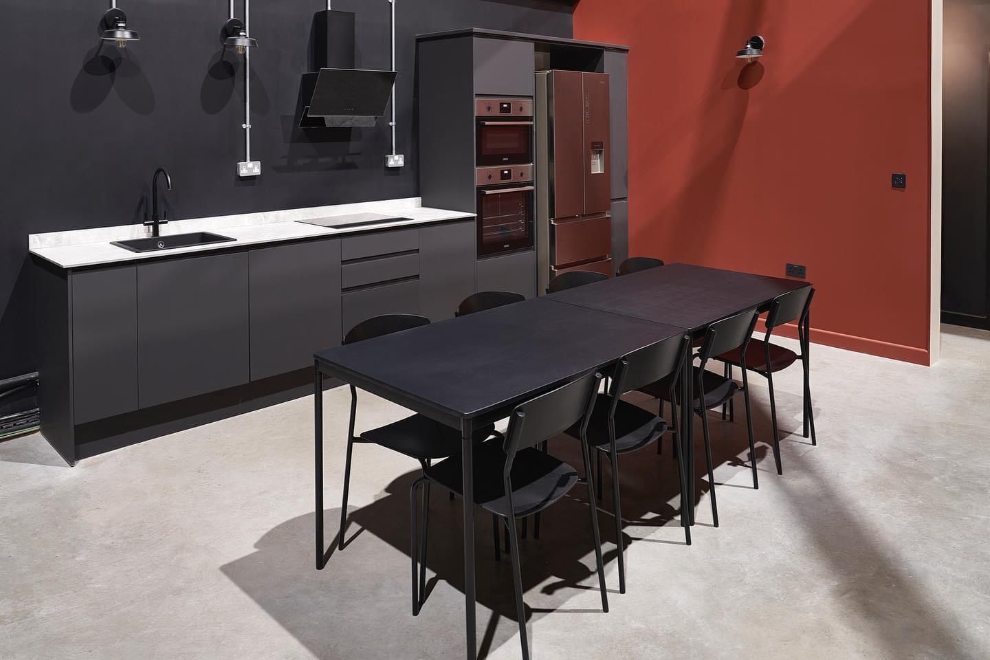 a kitchen with a table and chairs in it