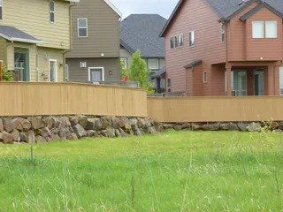 Houses and green field - Vancouver, WA - DJ Fence Service