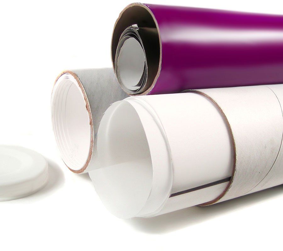 Three rolls of paper are stacked on top of each other