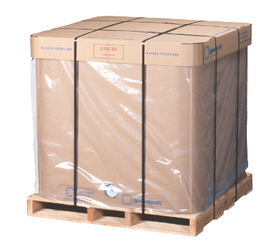 A large cardboard box is wrapped in plastic on a wooden pallet