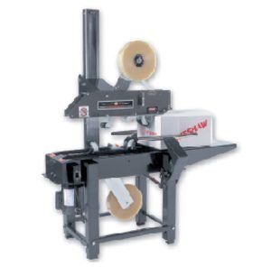 A machine is sitting on a table with a box on it.