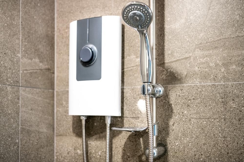 A Shower Head is Attached to a Wall in a Bathroom — Wahoo Plumbing in Golden Beach, QLD