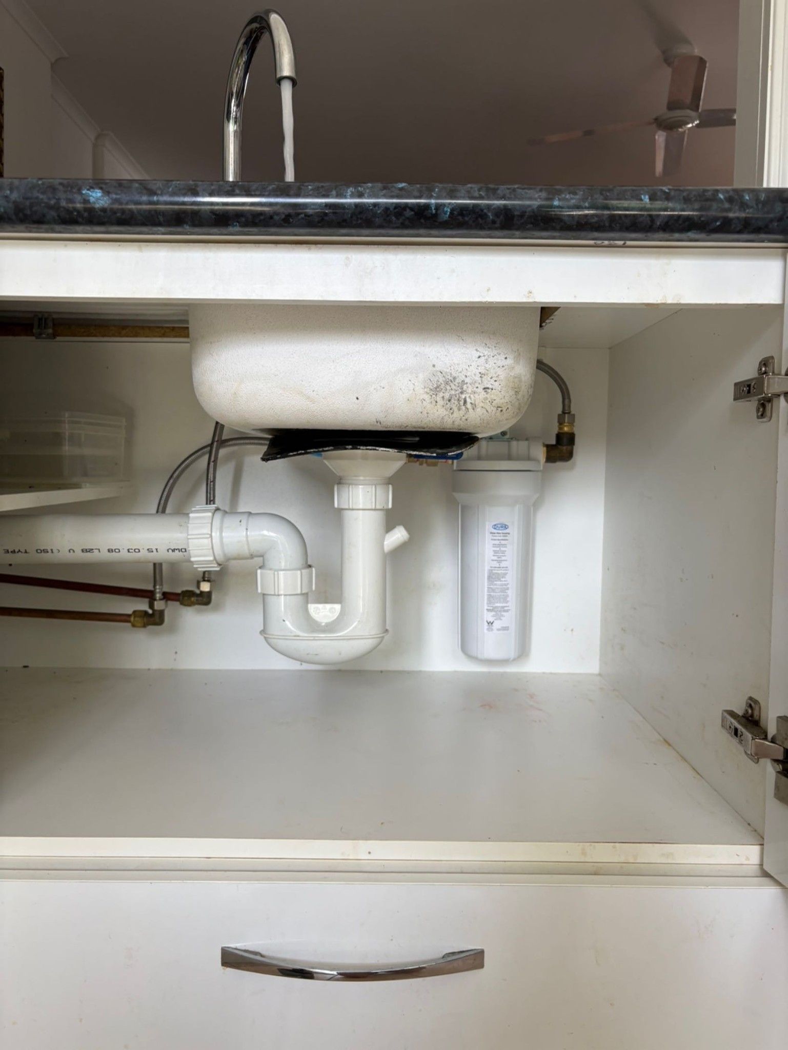 Underside of a Kitchen Sink With Plumbing — Wahoo Plumbing in Warana, QLD