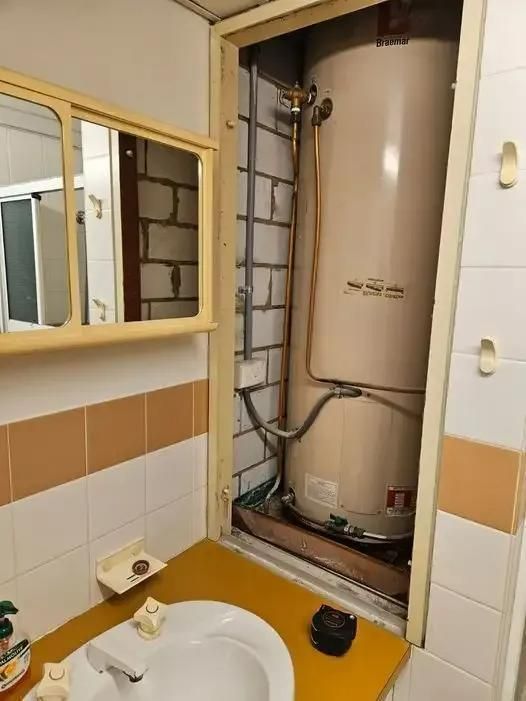 A Bathroom With a Sink and a Water Heater — Wahoo Plumbing in Maroochydore, QLD
