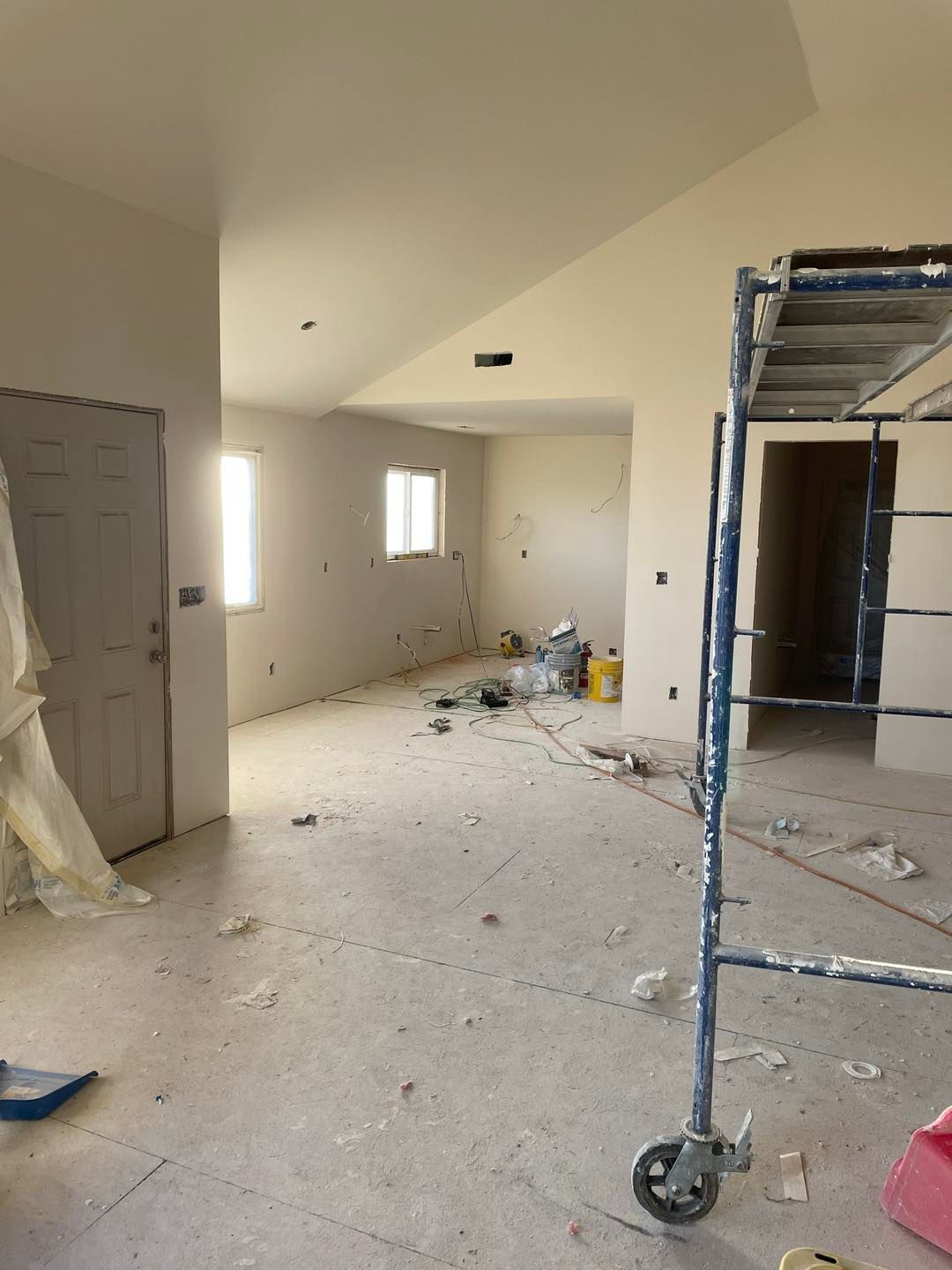 An empty room with a scaffolding in the middle of it