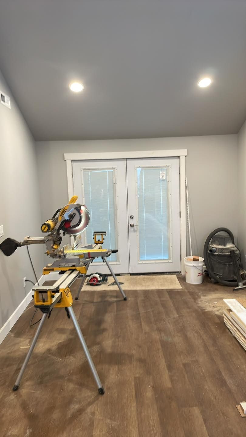 A room with hardwood floors and a sliding glass door.