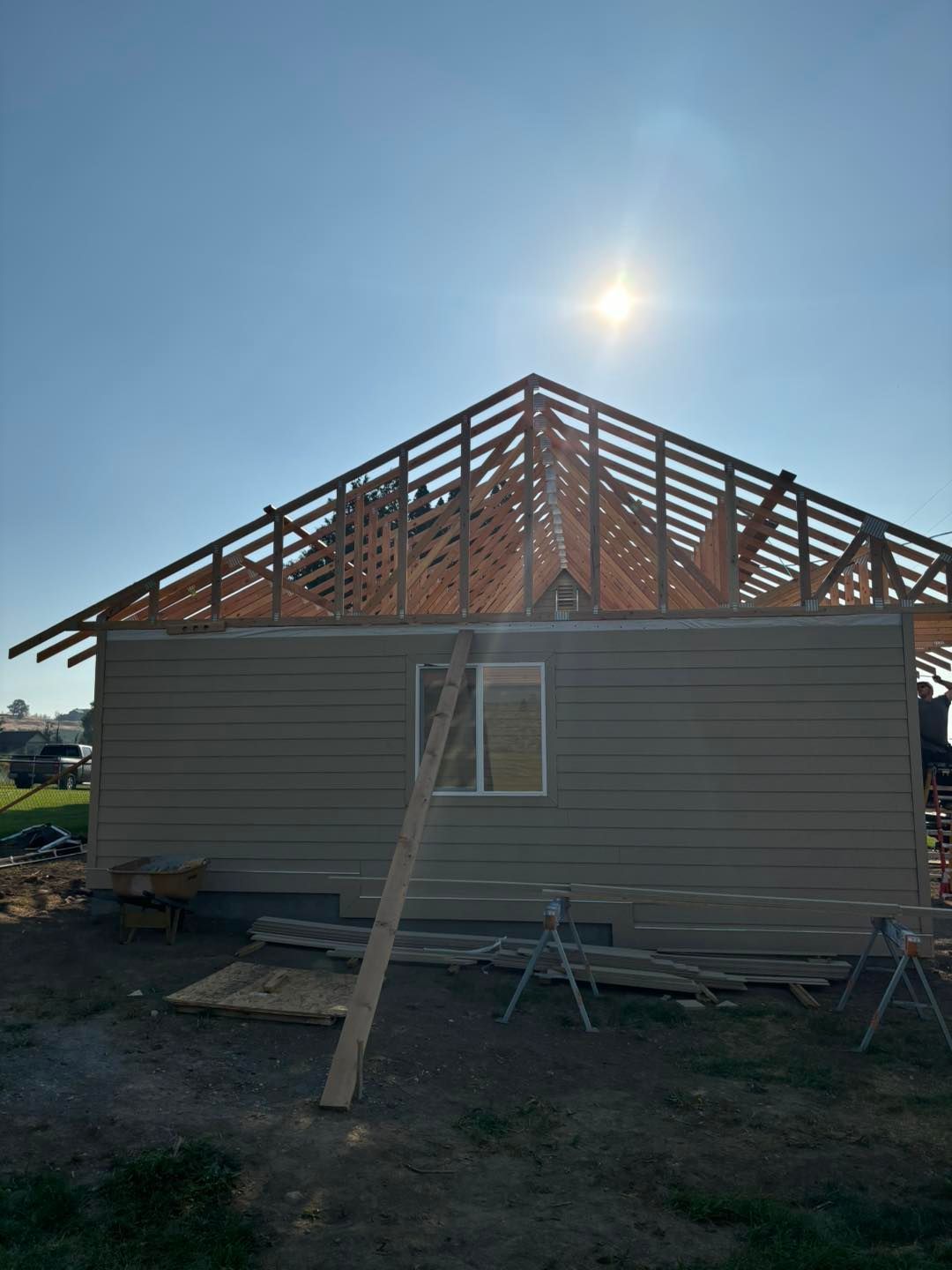 A house is being built with a wooden roof.