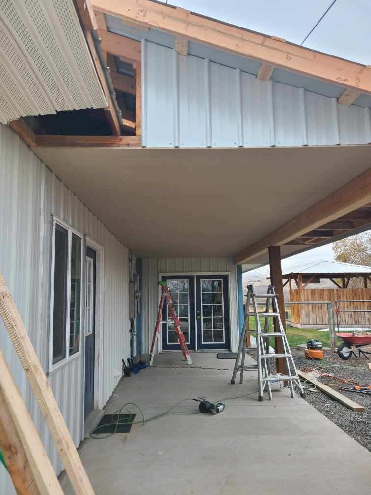 A porch is being built on the side of a house.