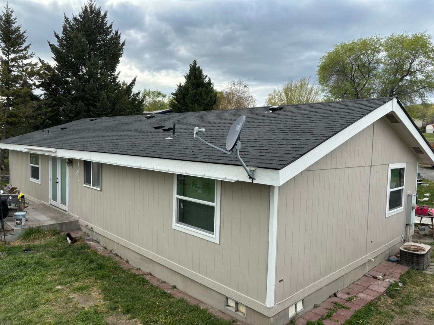 A house with a satellite dish on the roof.