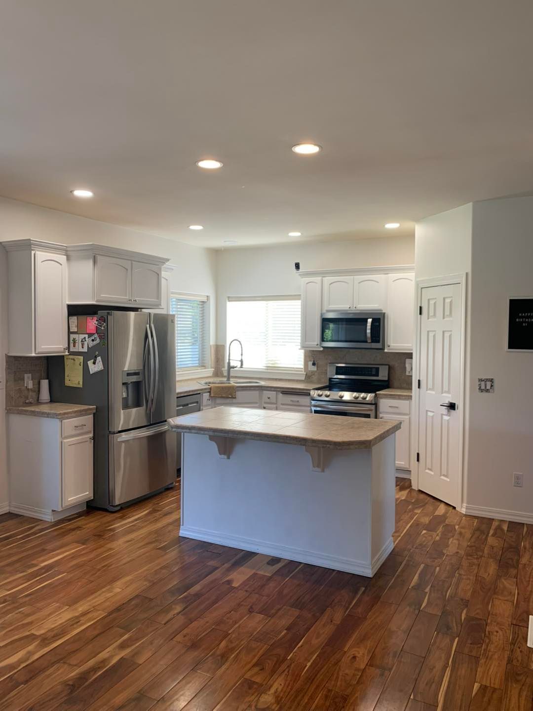 There is a large island in the middle of the kitchen.