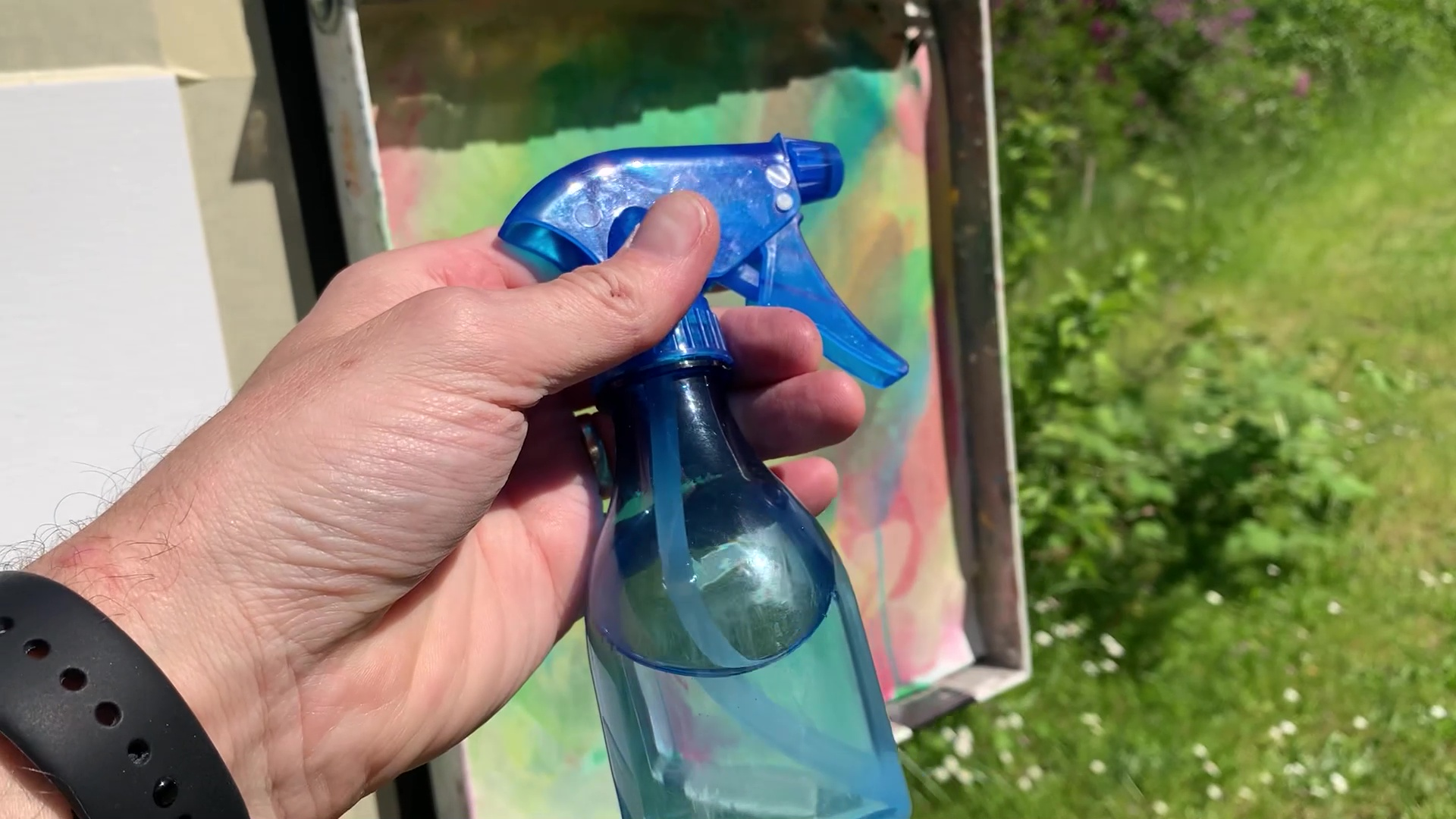 spray bottle in hand for acrylic painting