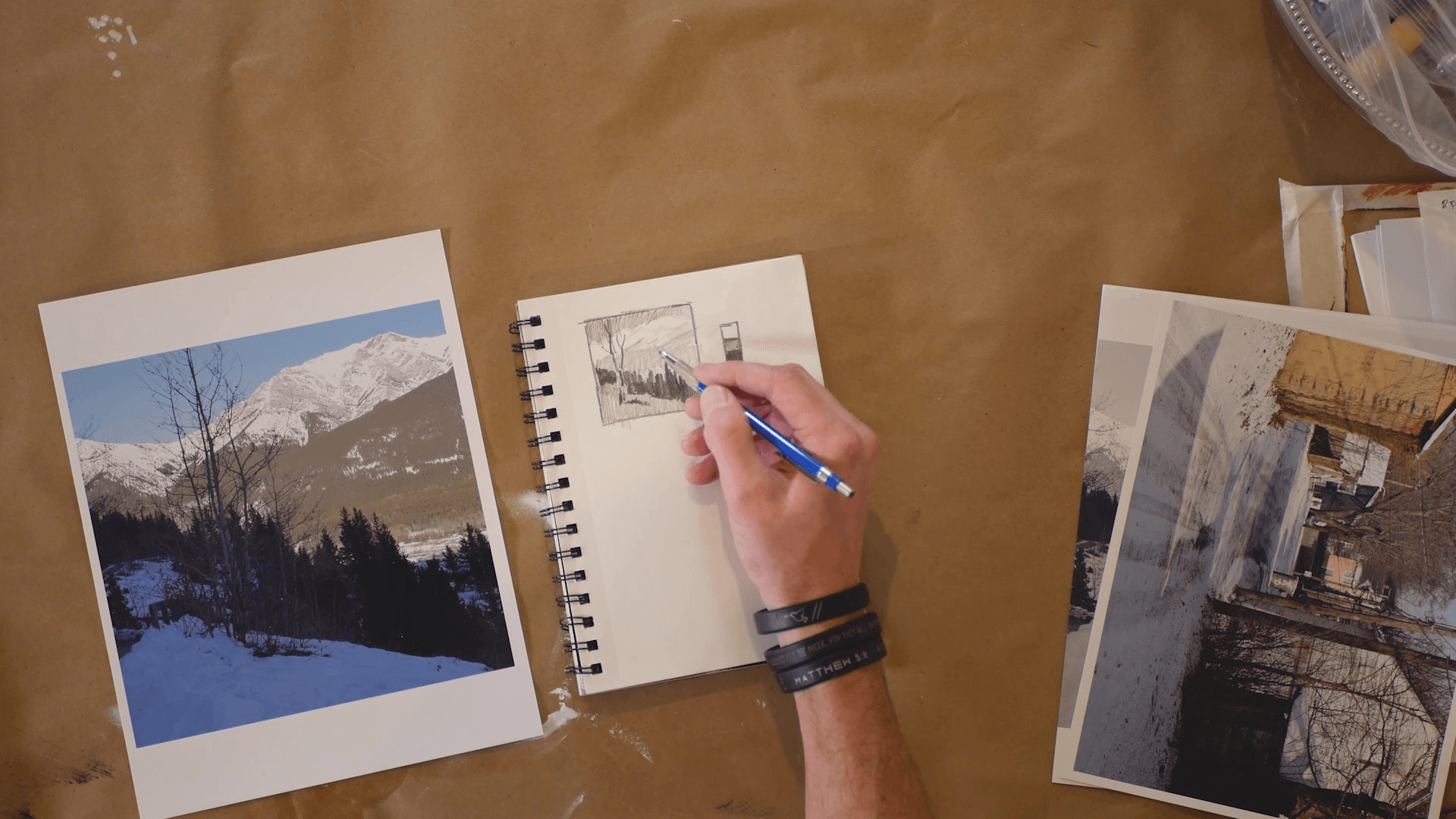 acrylic painter sketching a mountain