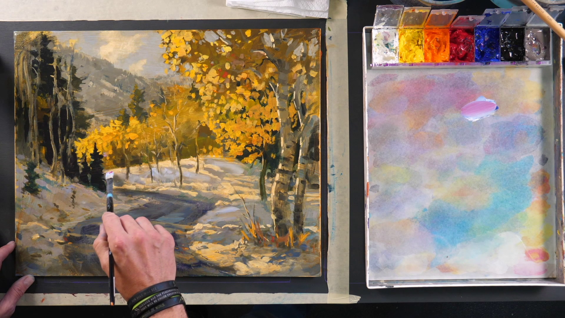 man mixing glazes on an acrylic painting