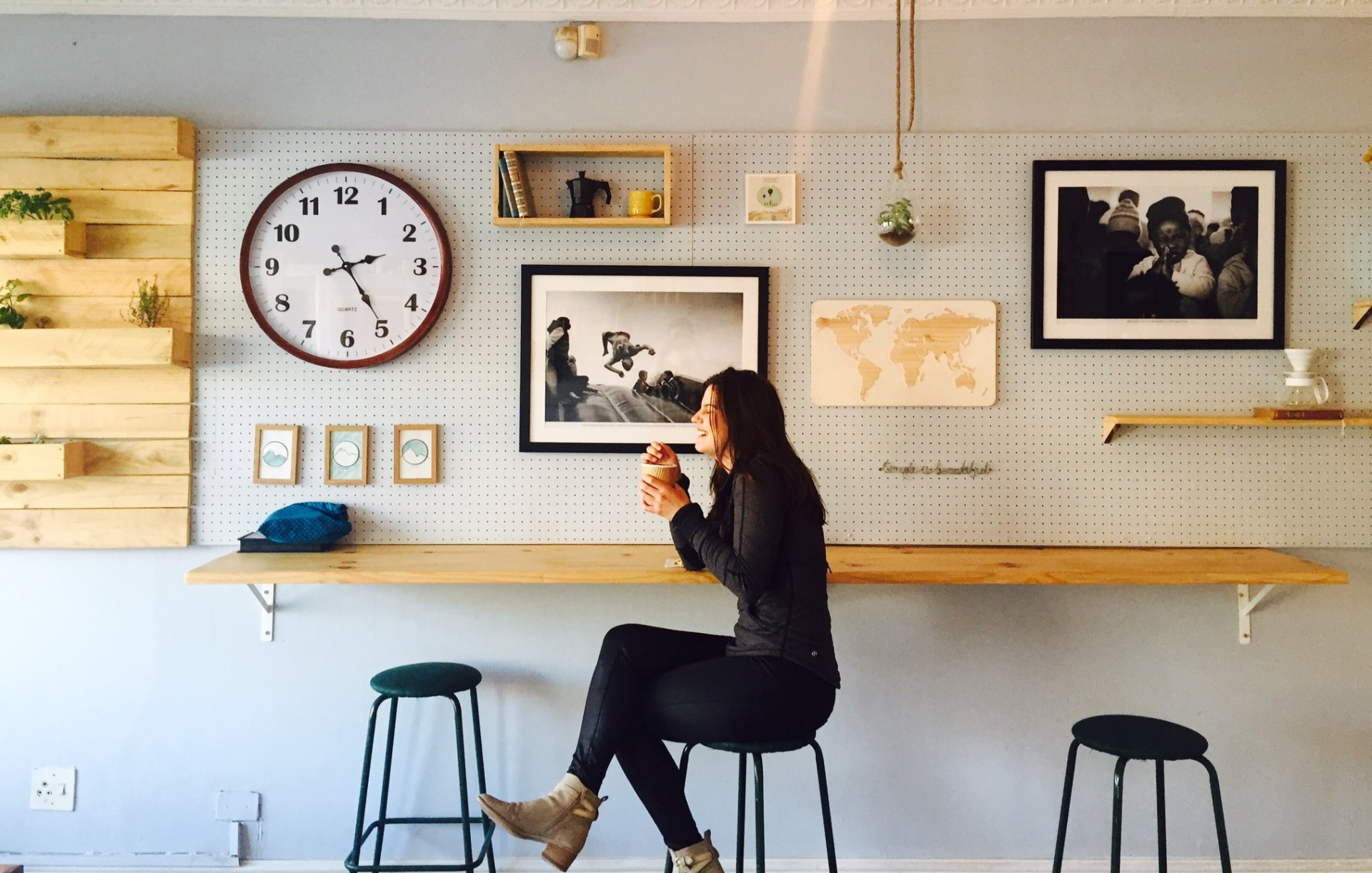 woman drinking a coffee inside a coffee shop