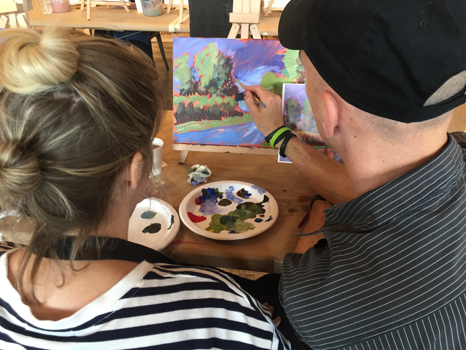 acrylic painter teaching a student to paint