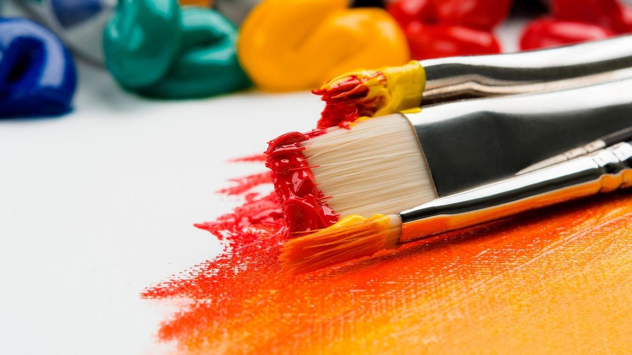paintbrushes with red and yellow paint