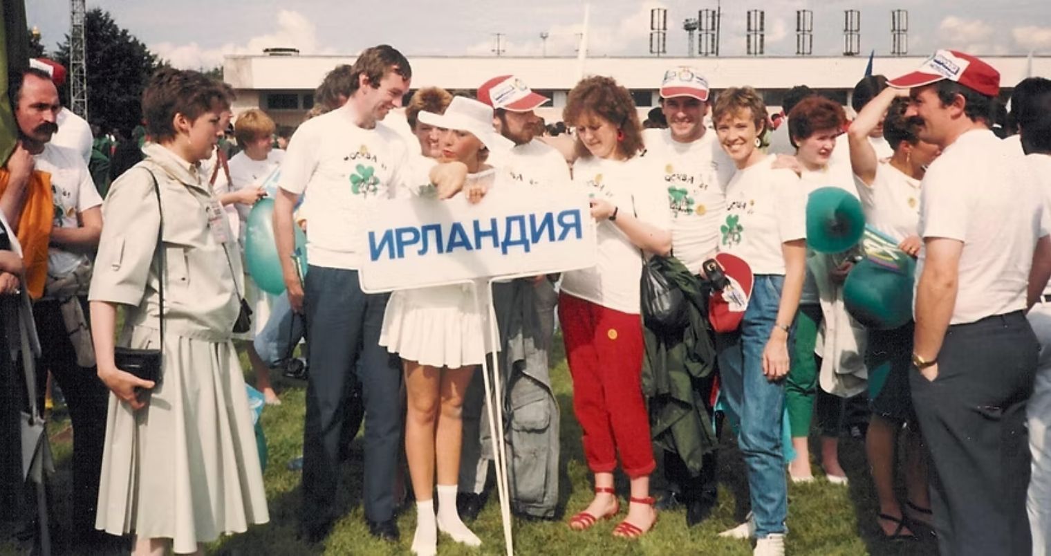 Group of people holding a sign that reads 