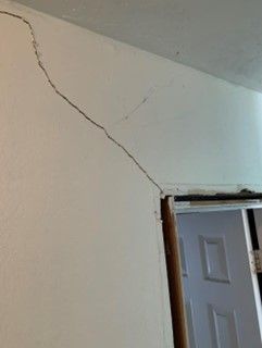 Structural damage, wall crack, door frame, ceiling joint, foundation settling, home inspection, repair assessment