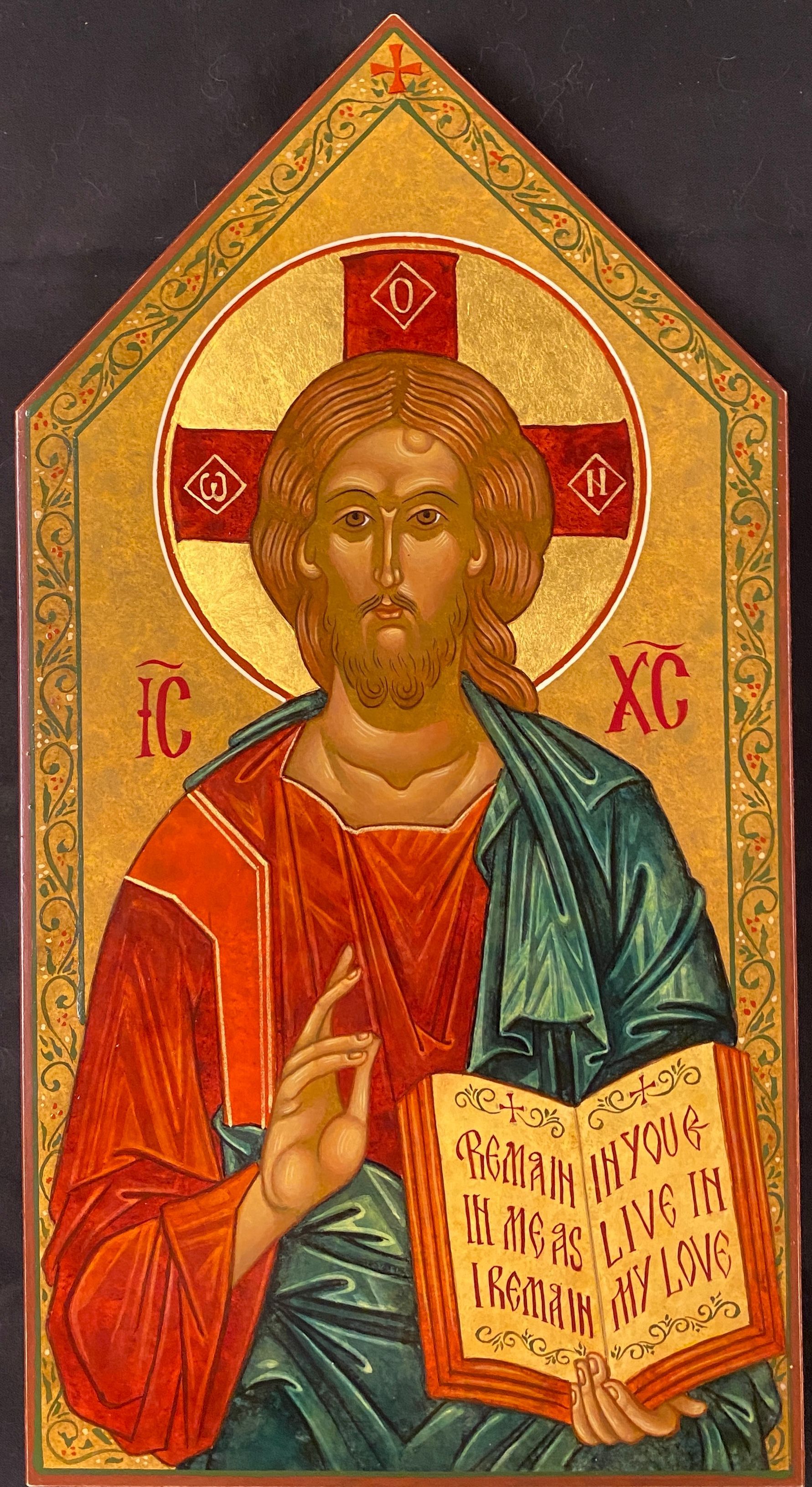 A religious icon of jesus holding a book