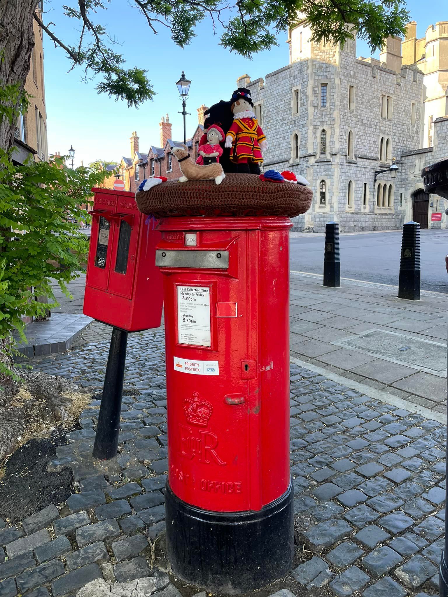 Traditional red post box near Windsor Castle in Windsor, England