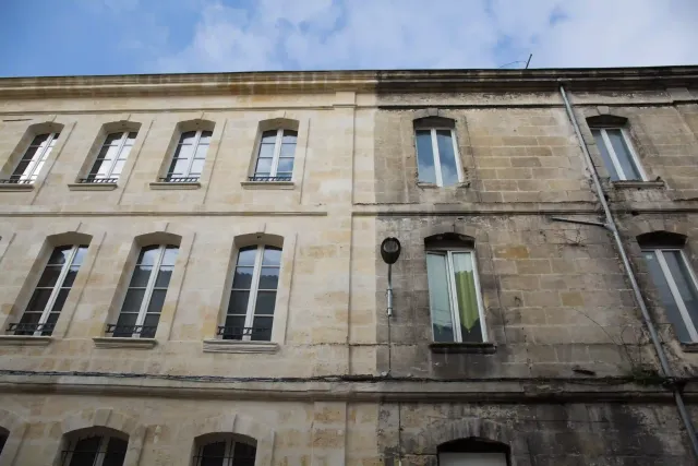 A before and after picture of a building with a lot of windows.