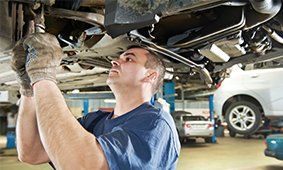 Auto Mechanic at Car Suspension Repair Work — Huntington Beach, CA — Britton's Automotive