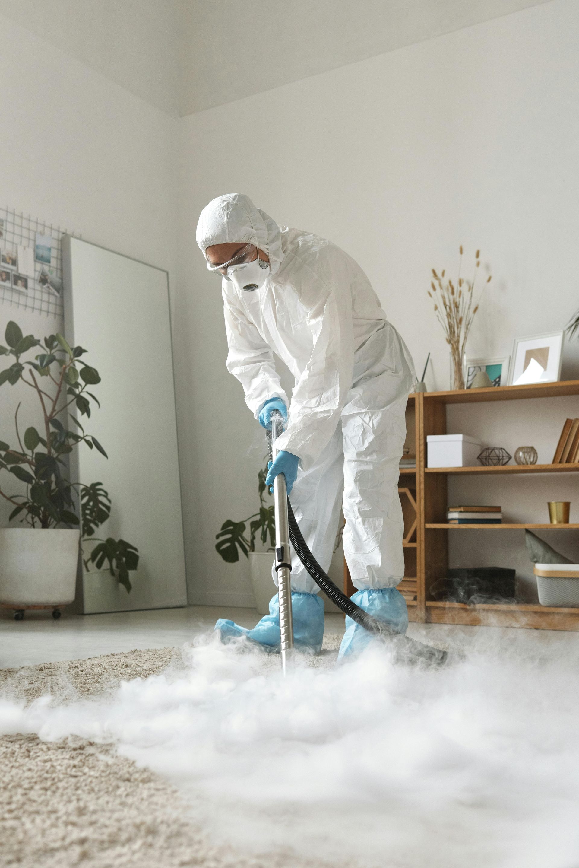 A vacuum cleaner is sitting on a carpet in a room.