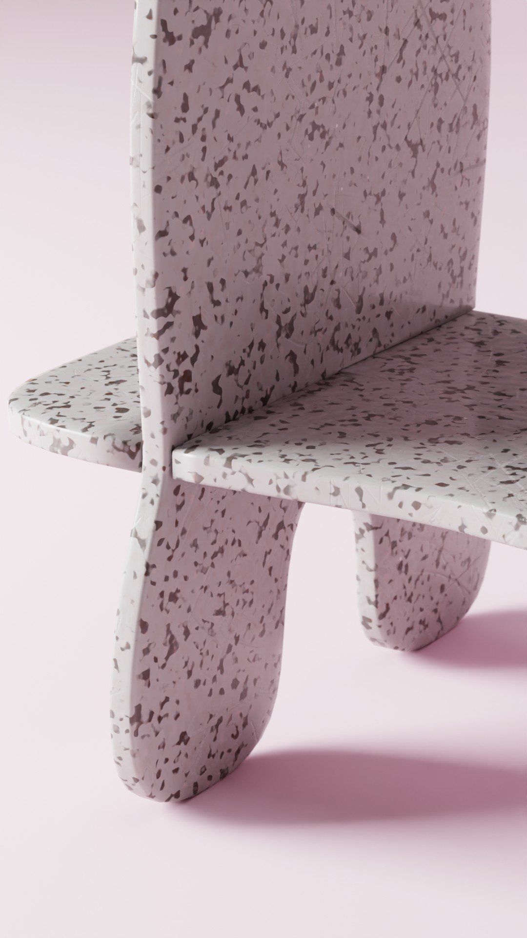 A close up of a marble chair on a pink background.