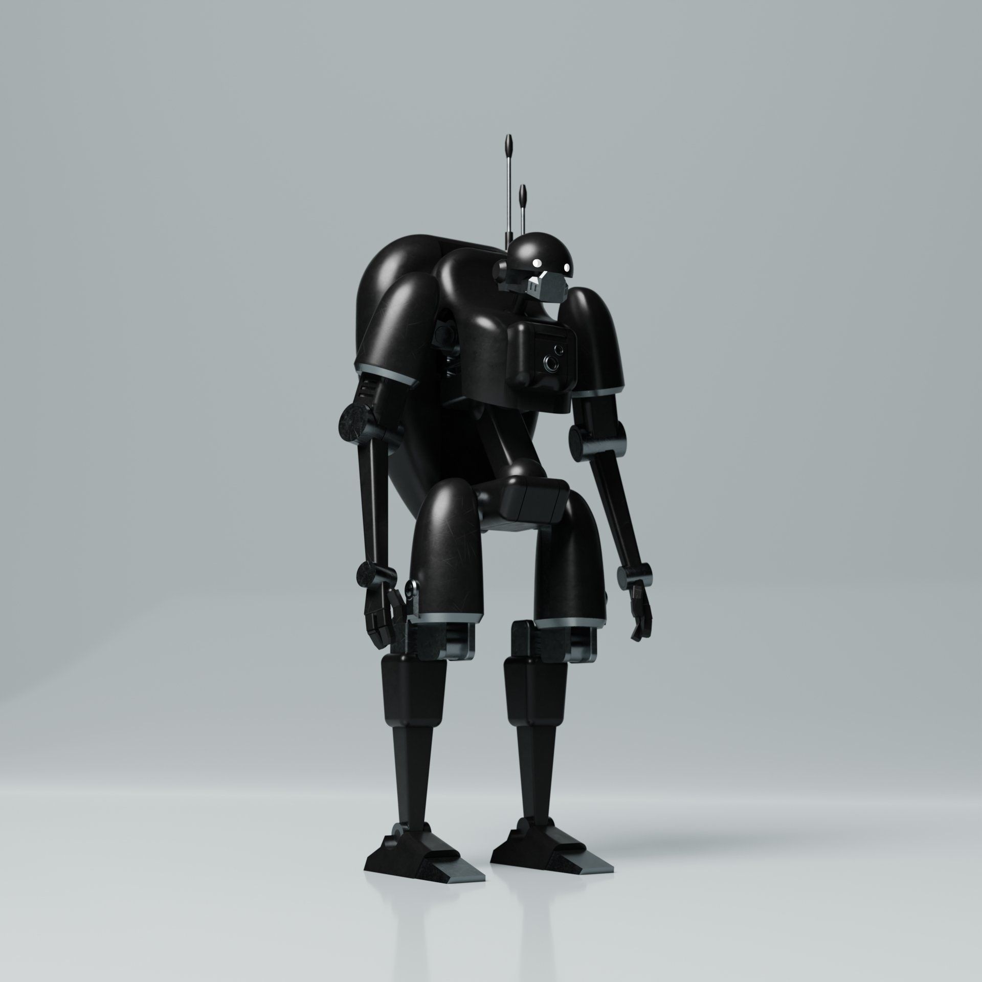 A black robot is standing on a white surface.