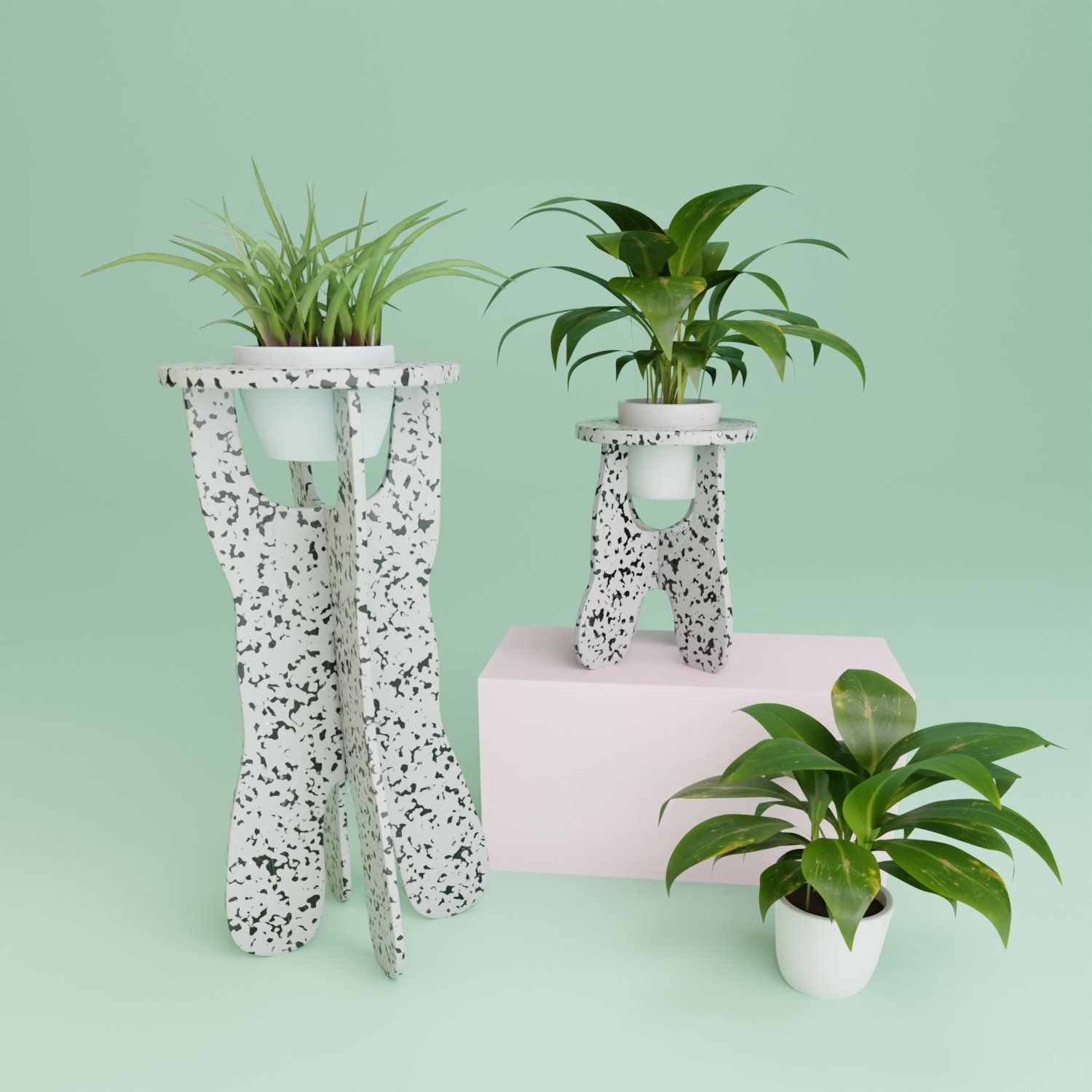 A couple of potted plants sitting on top of a table.