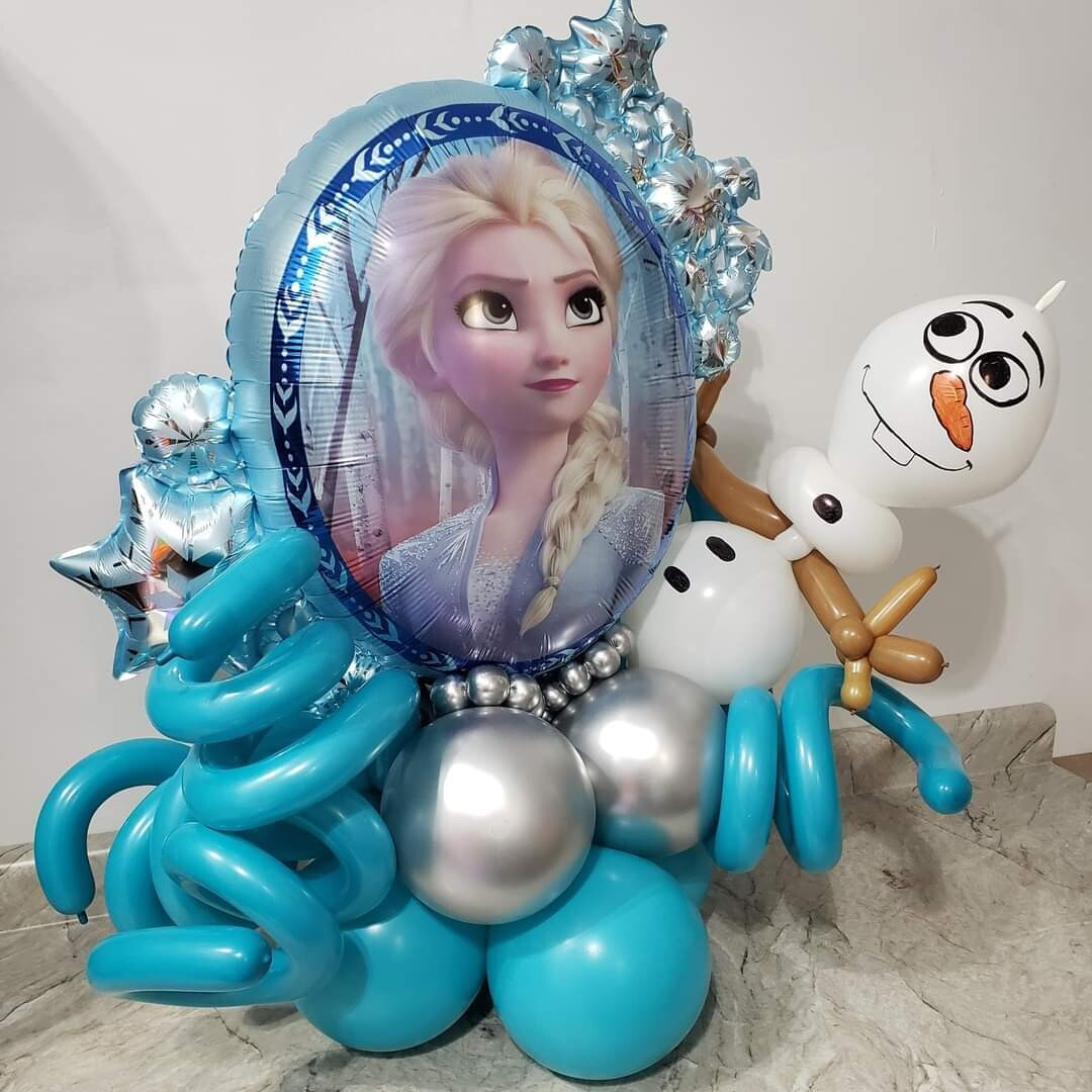 Frozen themed table top display. Elsa and Olaf balloon with assortment of  accent balloons. 