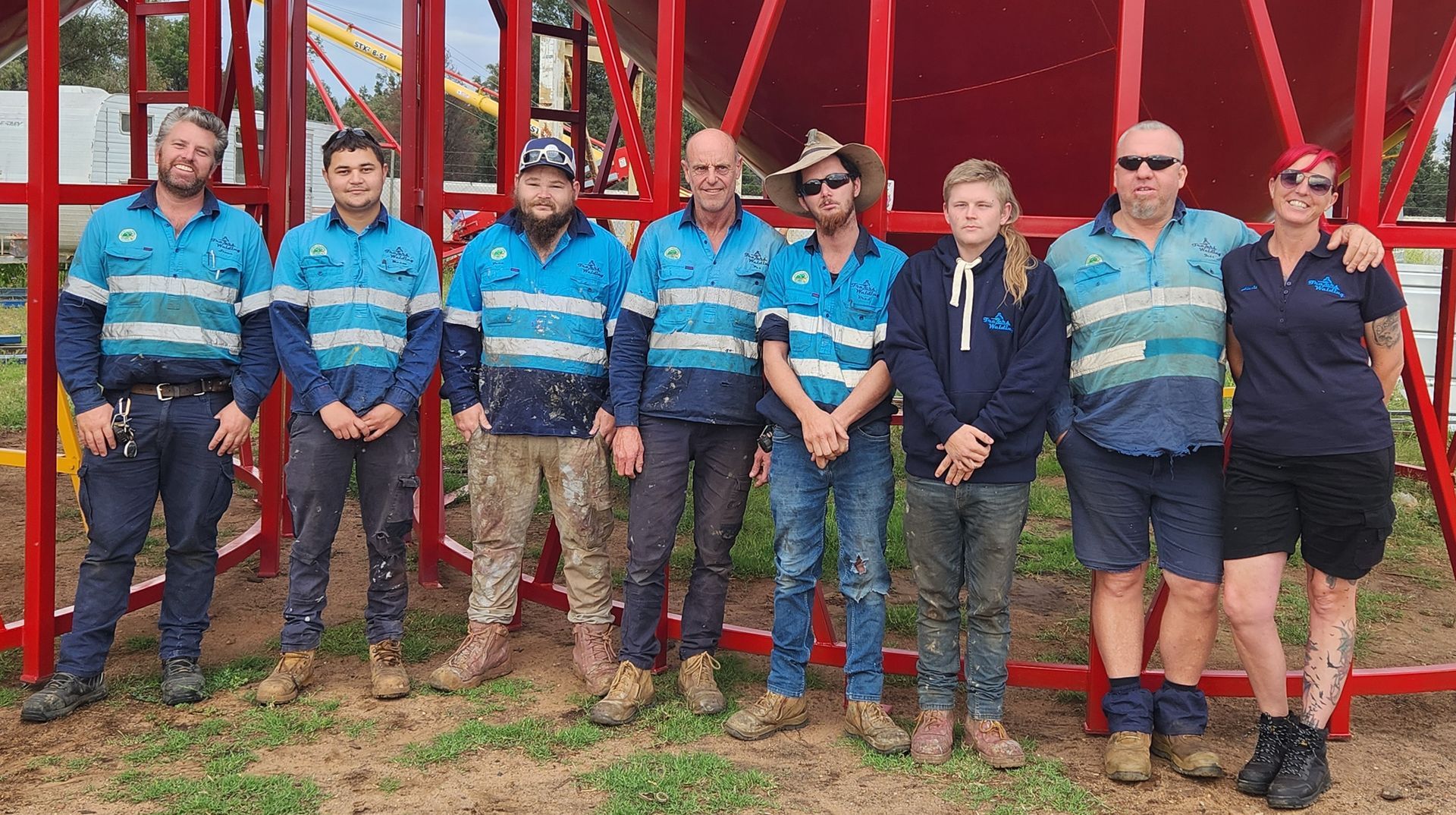 Three Men Infront Of Silo And Truck — Welders In Gilgandra, NSW