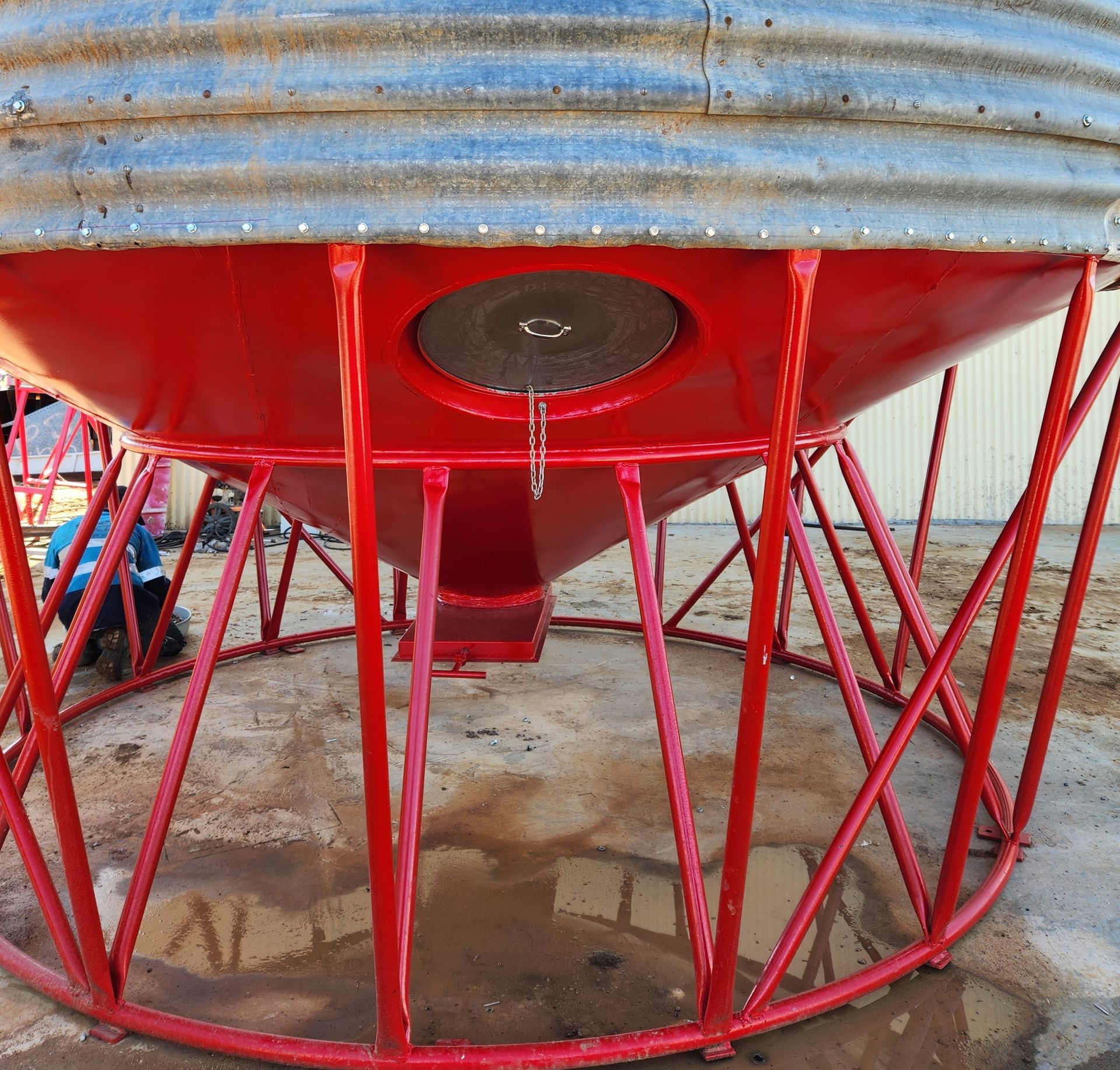 A Large Red Container is Sitting in a Red Frame — Welders In Gilgandra, NSW