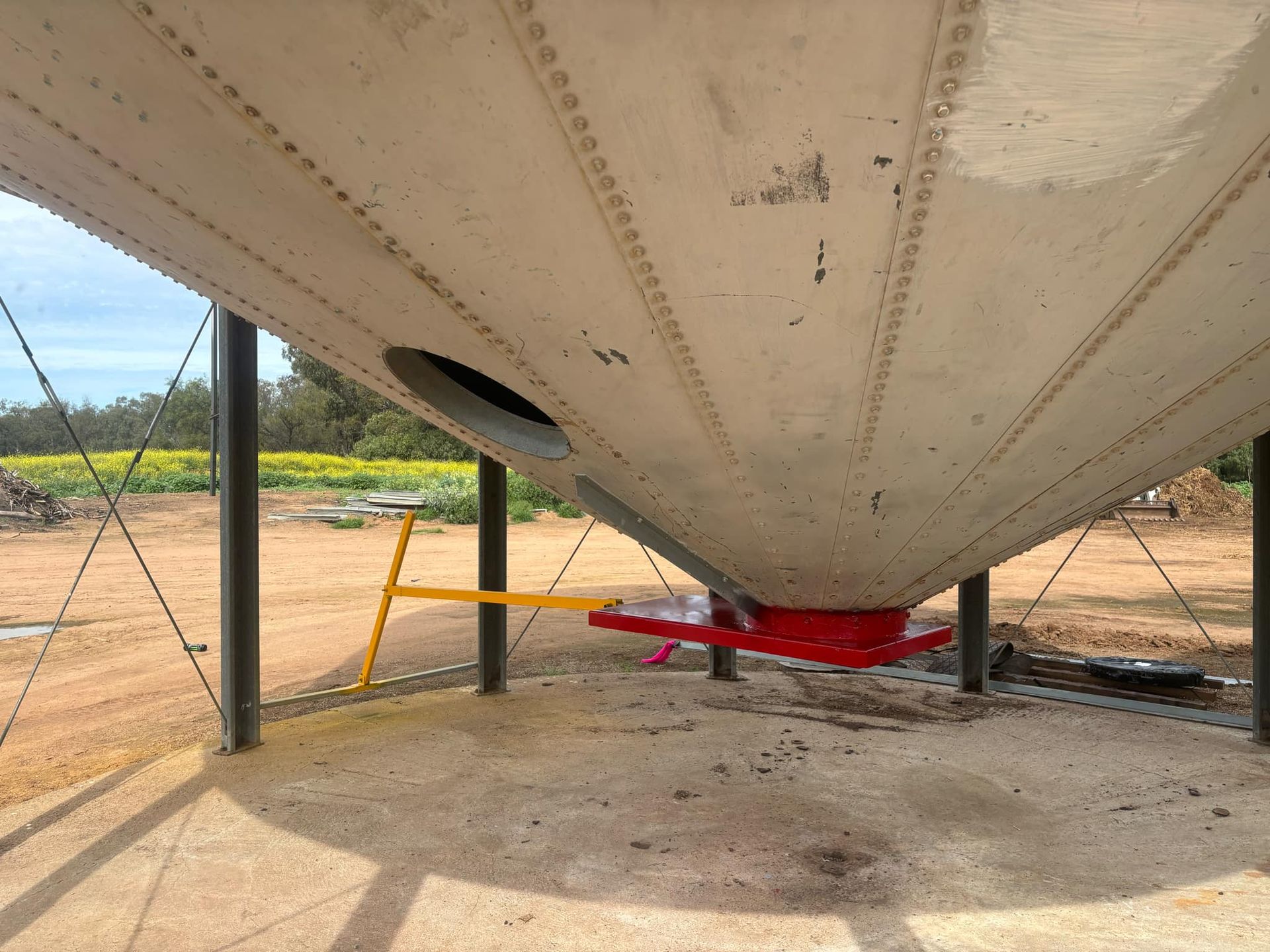 The Bottom of a Silo With a Red Handle on It — Welders In Gilgandra, NSW